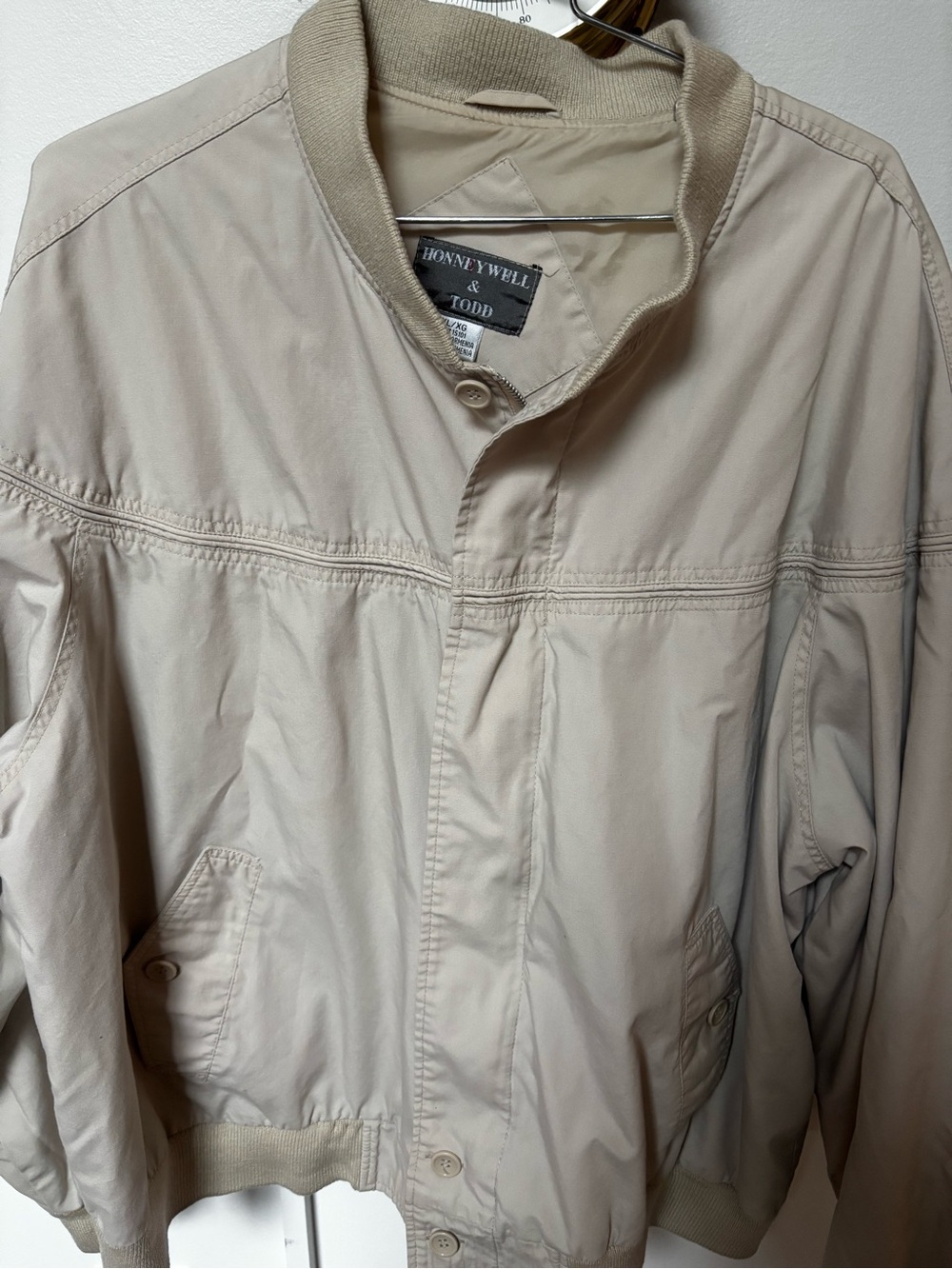 vintage Honeywell & Todd beige bomber-style windbreaker jacket.